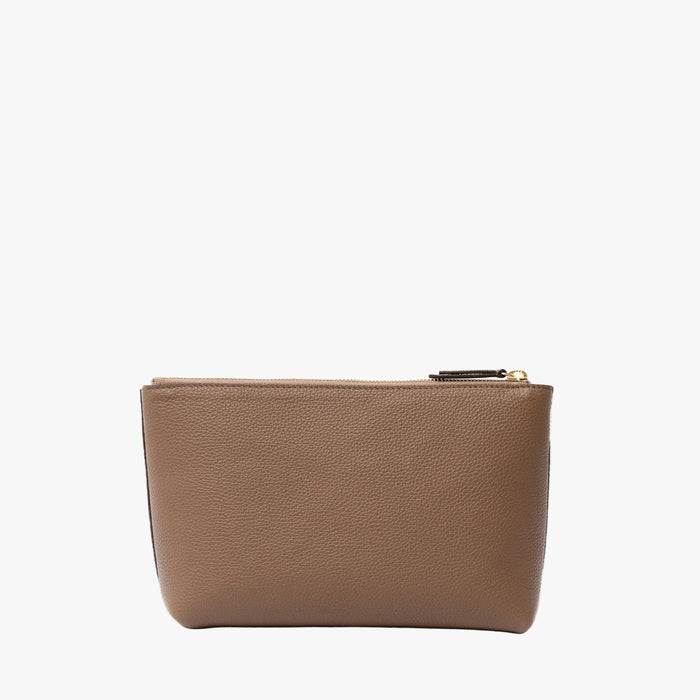 Back panel of STOW London's travel pouch in Mocha pebbled leather on a light grey background featuring a YKK zip
