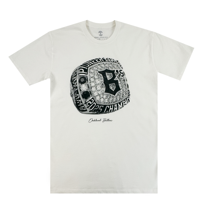 The Triumph Tee by Oakland Ballers features a detailed championship ring graphic with "Pioneers," "2005 Champions," a bold "B," and “Outfield Bullies” in script—perfect for Pioneer League or Oakland Ballers fans.