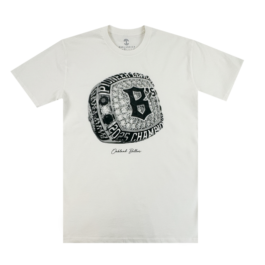 The Triumph Tee by Oakland Ballers features a detailed championship ring graphic with "Pioneers," "2005 Champions," a bold "B," and “Outfield Bullies” in script—perfect for Pioneer League or Oakland Ballers fans.