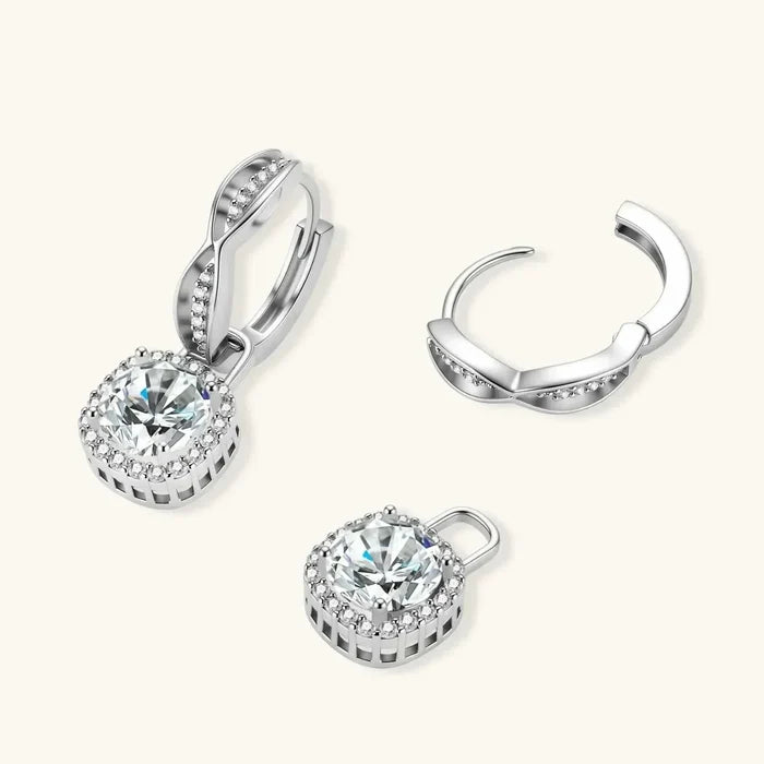 Twisted Infinity Halo Moissanite Earrings in polished silver with round clear stones, pavé halos and hinged huggie tops