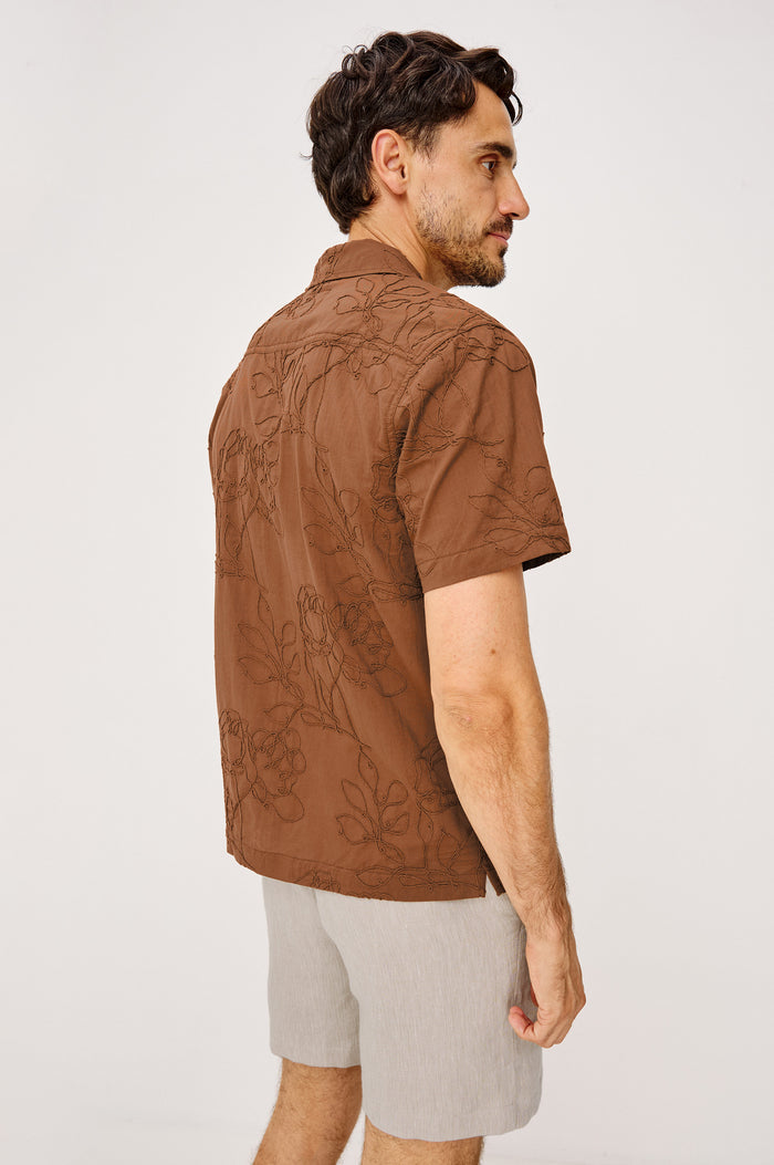 Tyler Shirt in Stretch Cotton With Floral Jute Embroidery, Front Buttons, Notched Collar, Short Sleeves, and Classic Fit in Rope Rust Colorway - Upper Body Back View Featured on Model