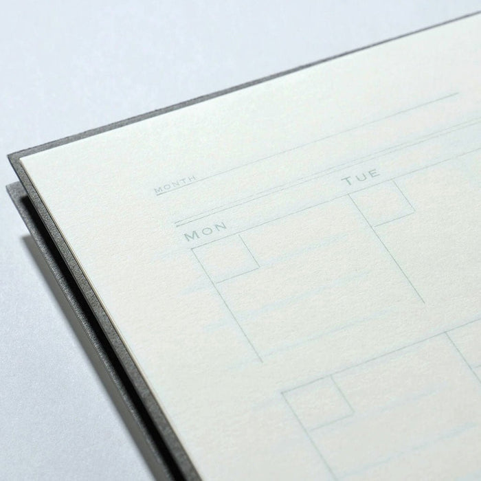 Undated calendar page with grid layout on a light gray background