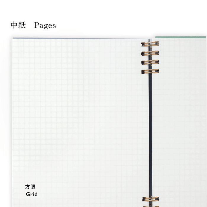 Open notebook with grid pages and spiral binding on a white background