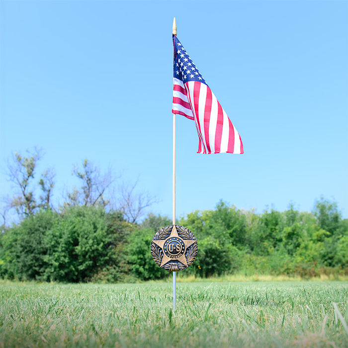 U.S. Veteran grave marker showing built-in cemetery flag holder