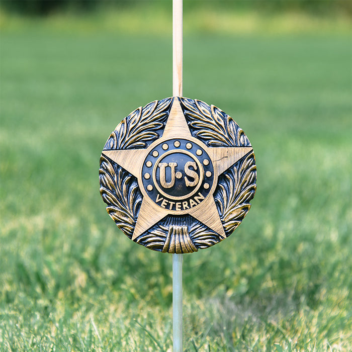 U.S. Veteran grave marker with flag holder installed beside headstone
