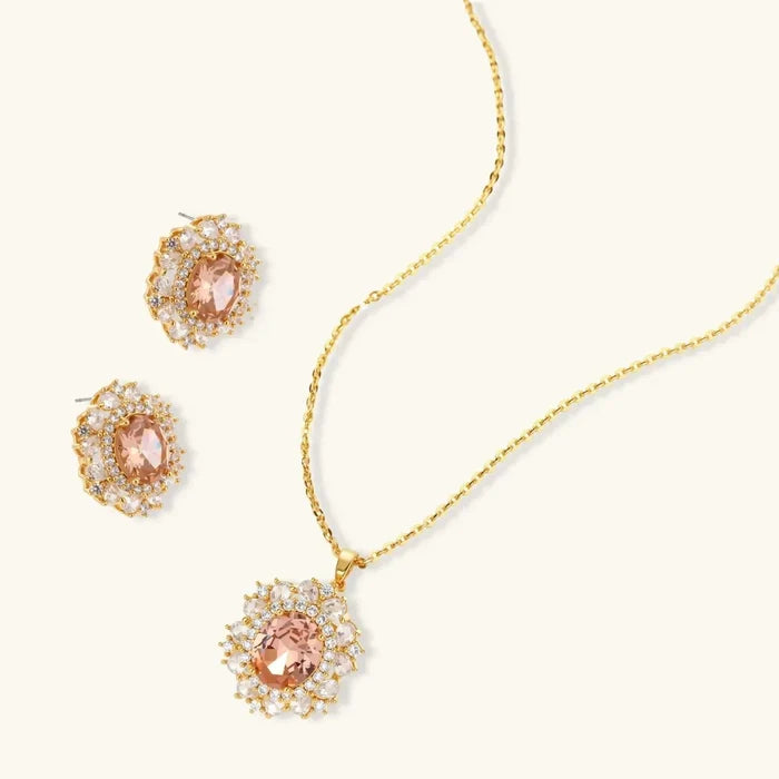 Vintage Glamour necklace and stud earring set in gold-tone metal with peach oval stones and clear halo accents