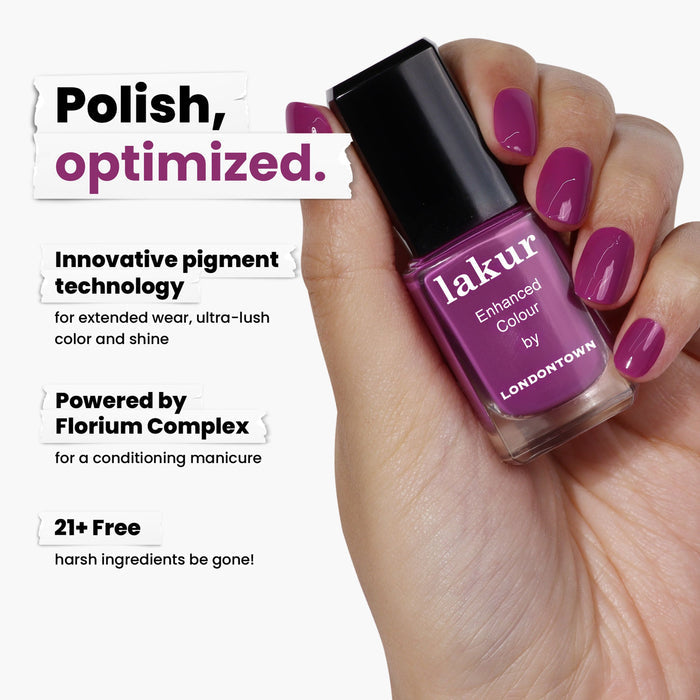 A hand elegantly holds a bottle of LONDONTOWN lakur nail polish in Violet Hibiscus. The text highlights its innovative pigment, enriched with Florium Complex, and being 21+ free of harsh ingredients.