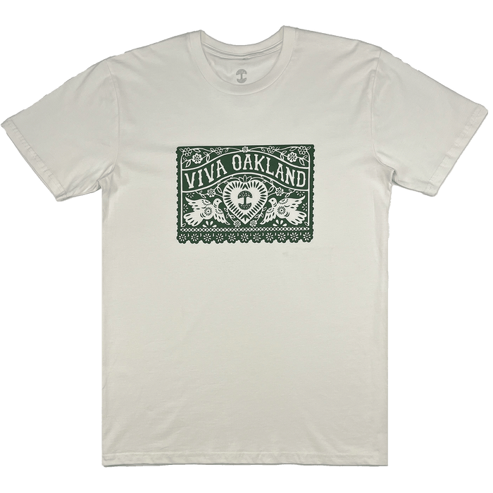 The Viva Oakland Tee by Oaklandish is a classic fit, 100% cotton white T-shirt adorned with a meticulously crafted green graphic on the front. This intricate design prominently features "Viva Oakland" at the top and showcases a central circular emblem of a tree, surrounded by ornate floral and decorative patterns, exuding a traditional, lacy appearance.