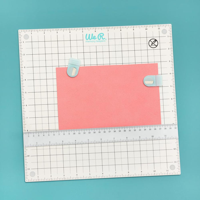 We R Memory Keepers - All-In-One Magnetic Platform. The All-In-One Magnetic Platform is perfect for stenciling, aligning, embossing, and cutting. One side is an easy-clean work surface. Available at Embellish Away located in Bowmanville Ontario Canada.