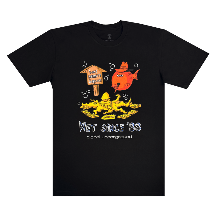 The Wet Since ’88 Tee by Other features a black base with hand-drawn yellow and orange cartoon fish. A playful speech bubble declares, “LIKE A PEACH, BROTHER!” while white text below reads “Wet Since ’88” and “digital underground.” Inspired by the fun energy of Underwater Rimes and Digital Underground, this Oakland t-shirt is ideal for those who love bold, creative style.