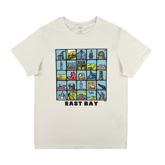 The Oaklandish Women's East Bay Landmarks Tee is a white shirt with a vibrant grid of cartoon-style East Bay icons and landmarks, finished with bold "EAST BAY" text below the design.