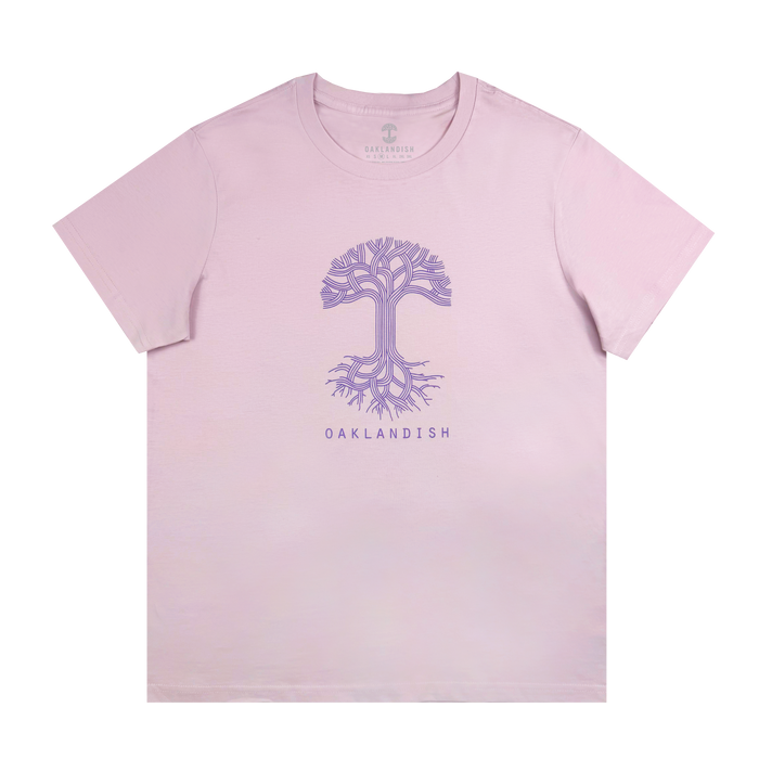 The Women's Oaklandish Classic Logo Tee, a 100% cotton light orchid pink t-shirt, displays a stylized purple tree with intricate roots and branches centered above "OAKLANDISH" in purple.
