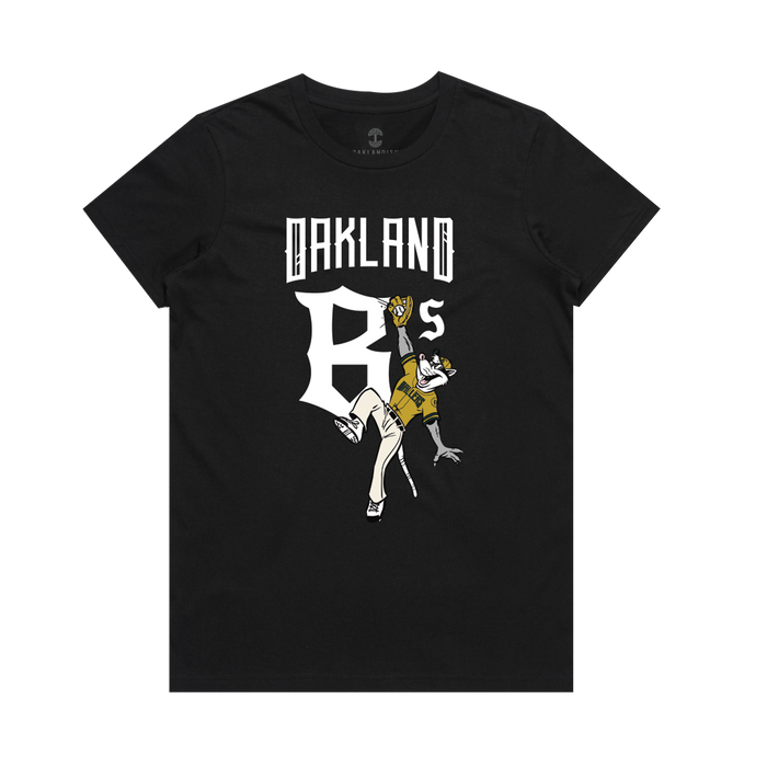 Women’s Scrappy Jumps Tee by Other—this black tee features “Oakland B’s” in bold white letters across the chest. Beneath, a playful cartoon bee dressed in a yellow cap, yellow shirt, and white pants catches a baseball, capturing the energetic spirit of Oakland Ballers fandom. The design pops against the plain background, perfect for showing your support with style.