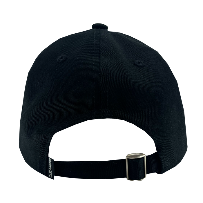 Back view of the Oaklandish WPBA Dad Hat. The black baseball cap features a curved brim and an adjustable strap with a metal buckle for size adjustment. The fabric has a slightly textured finish. There is a small fabric tag near the buckle with the text "BALR. BLACKOUT" written on it, celebrating women's sports empowerment.