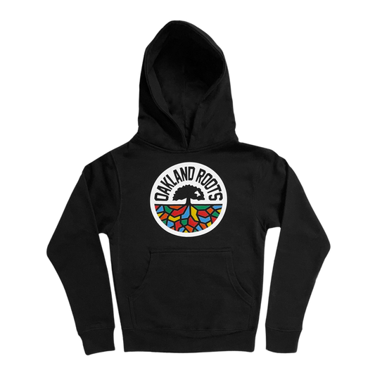 An Oakland Roots SC youth pullover hoodie in black, featuring a front pocket. The hoodie showcases a circular tree logo with vibrant, colorful roots and the text "OAKLAND ROOTS," embodying its Oaklandish design.