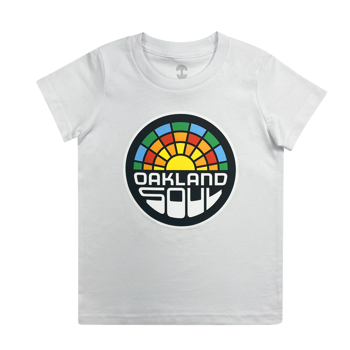 The Youth Oakland Soul Logo Tee features a striking white finish and a vibrant circular graphic on the front. The design showcases a rainbow with a yellow sun at its center, accompanied by the bold text "OAKLAND SOUL" in capital letters below, celebrating women's soccer and Oakland Soul's participation in the USL W-League.