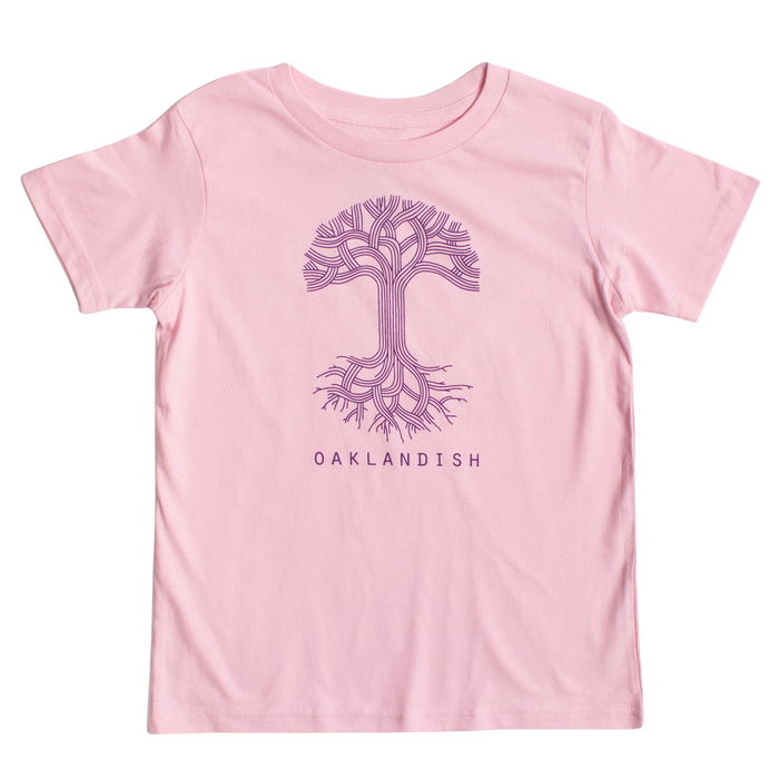 The Youth Oaklandish Classic Logo Tee by Oaklandish features a pink base adorned with a stylized purple tree graphic on the chest. The tree showcases intricate, branching roots and limbs that mimic circuit board patterns. Below the tree, "OAKLANDISH" is printed in bold purple capital letters. Crafted from 100% cotton, it ensures ultimate comfort.